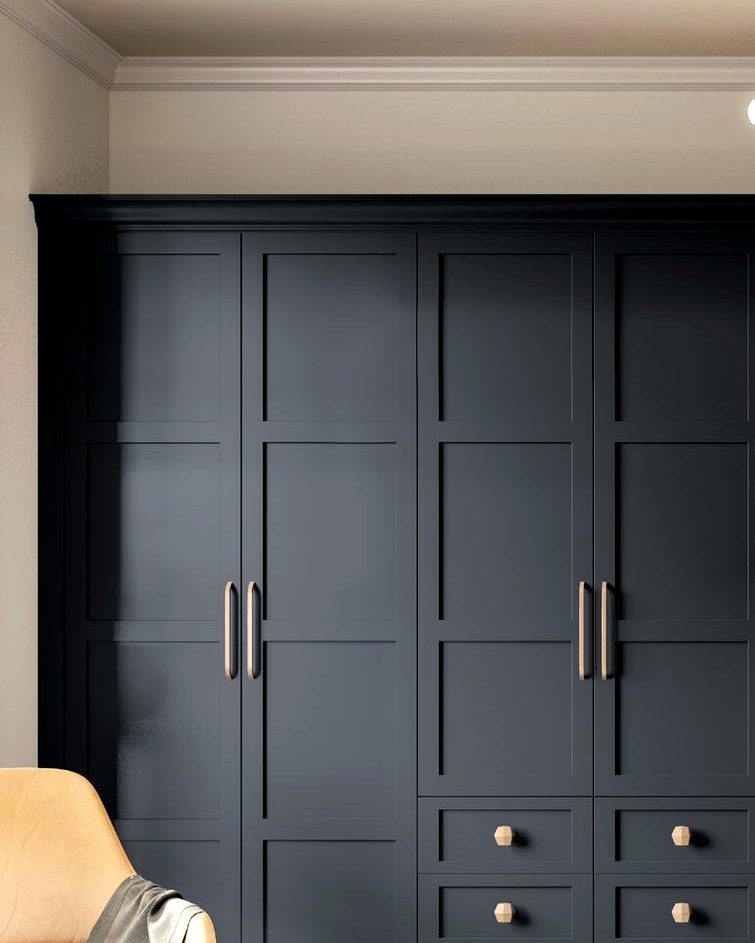 Design visualisation of a navy blue Shaker-style bespoke fitted wardrobe with brass handles