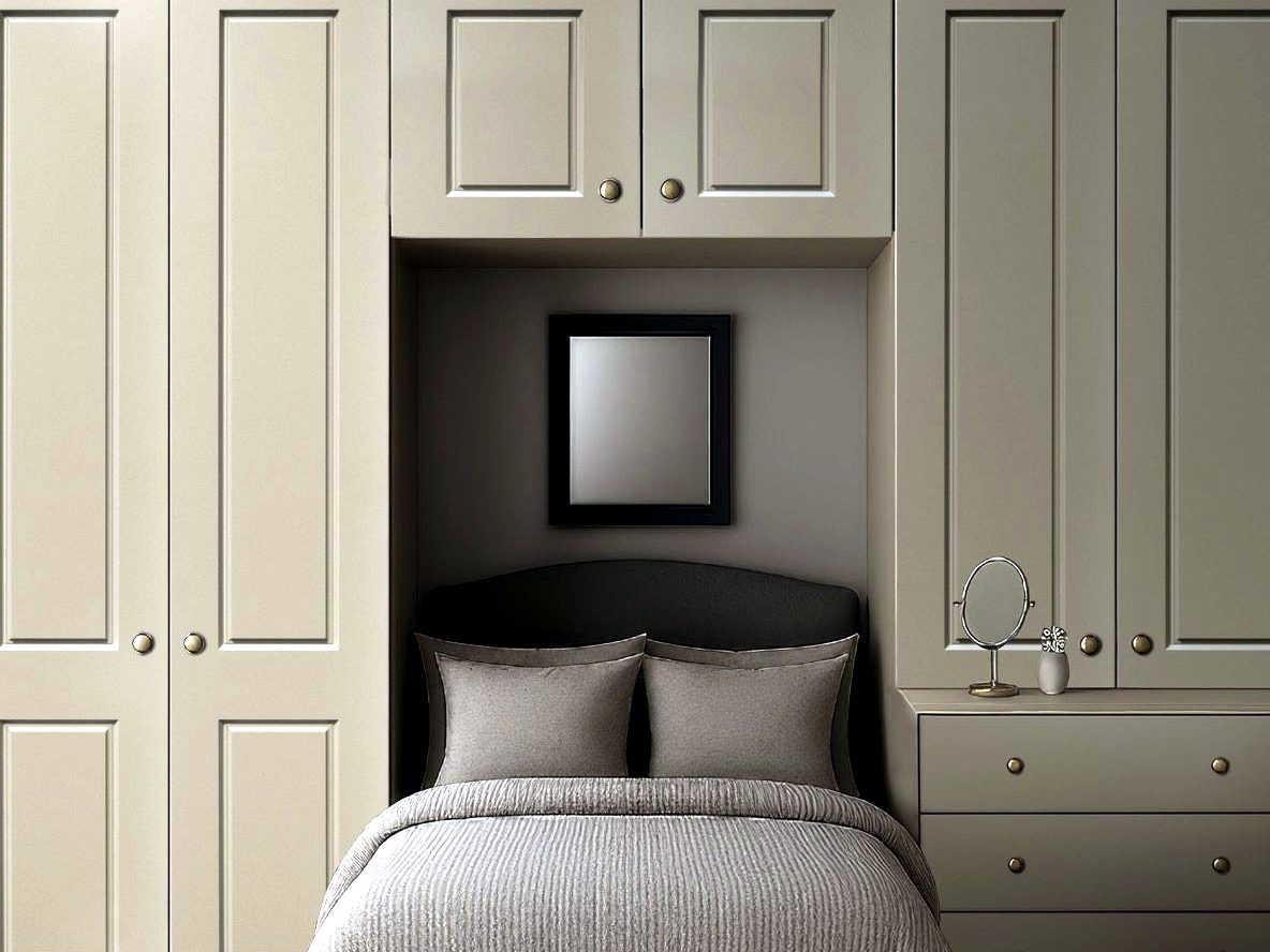 Design visualisation of a taupe painted overbed wardrobe suite with raised panel doors and bedside drawers